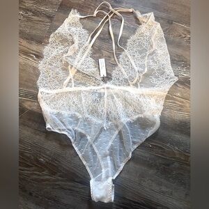 Victoria’s Secret pale pink teddy, new with tags. Size medium.